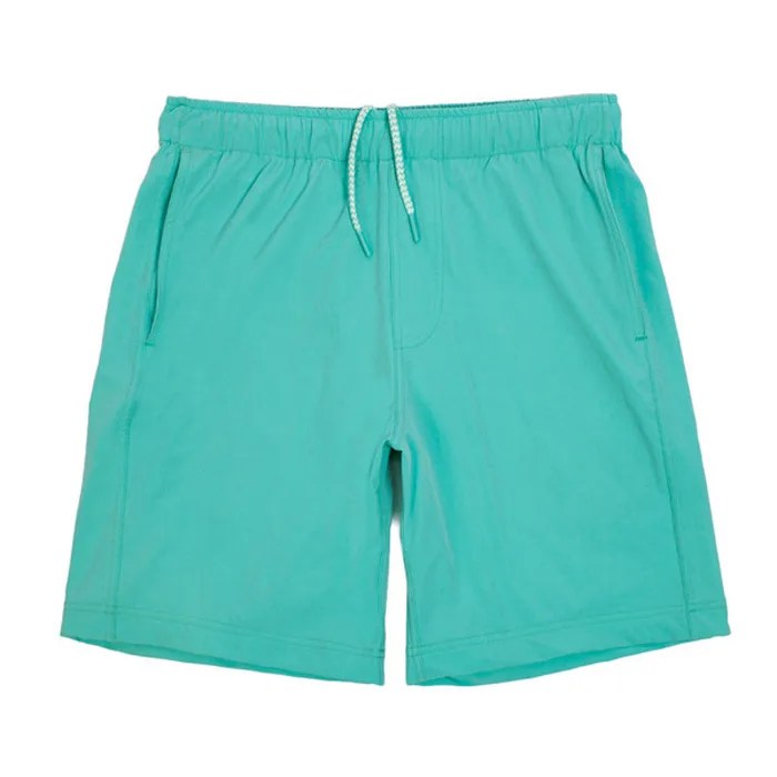 Teal drawstring shorts on a gray background.
