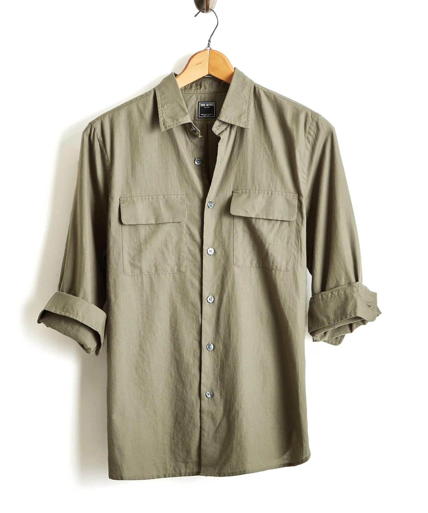 Olive two pocket button down shirt on hanger