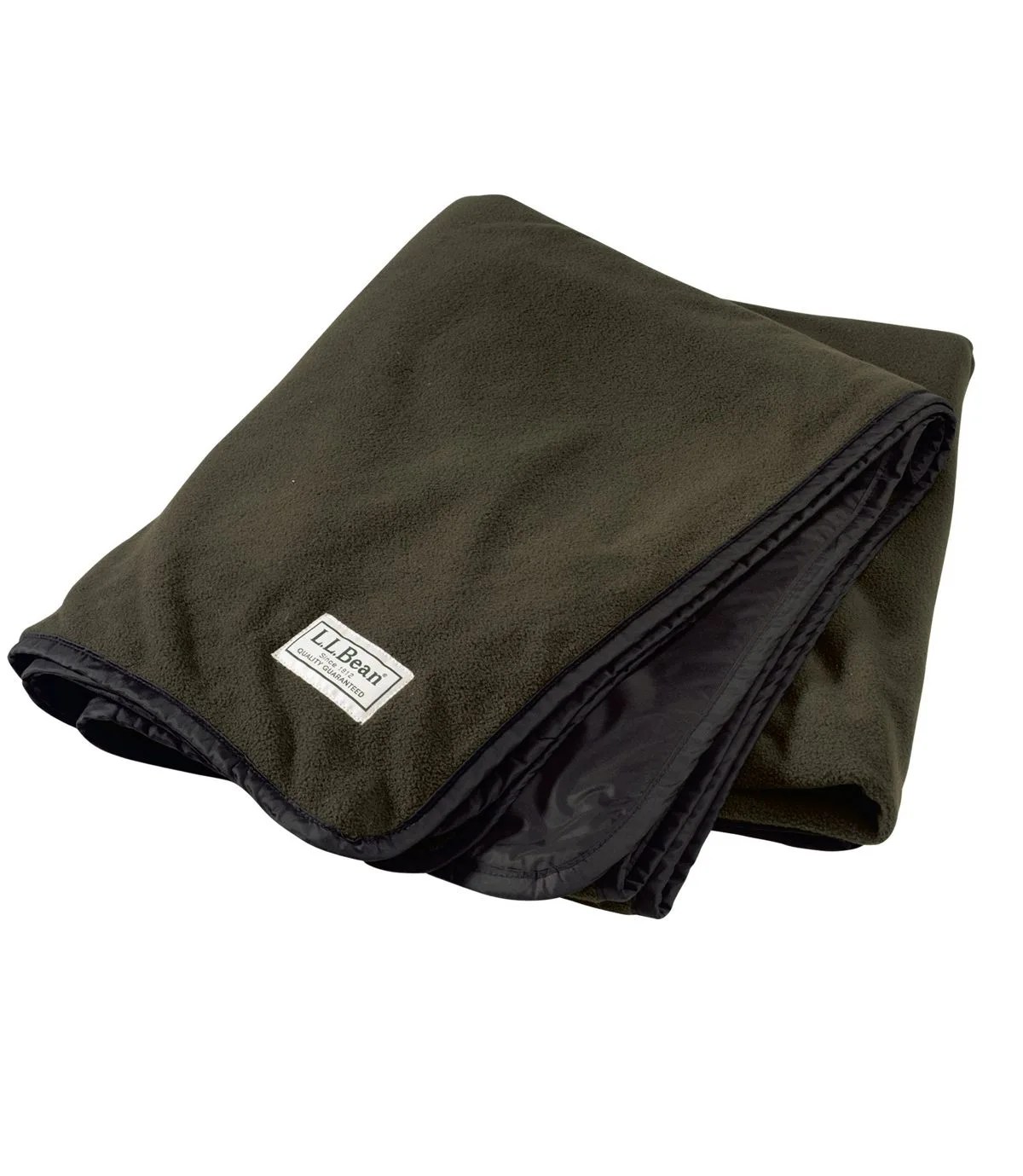A green fleece blanket on a gray background.