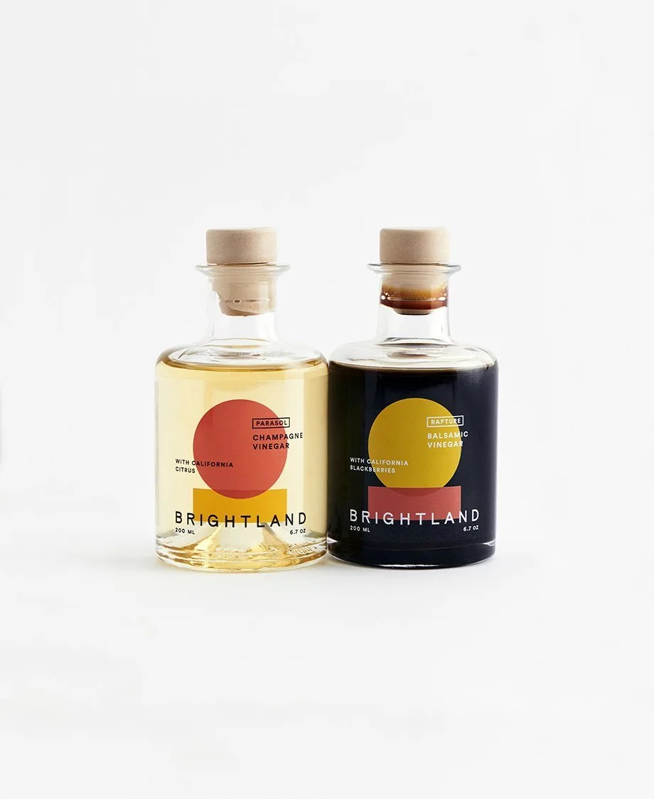 side-by-side bottles of champagne vinegar and balsamic vinegar