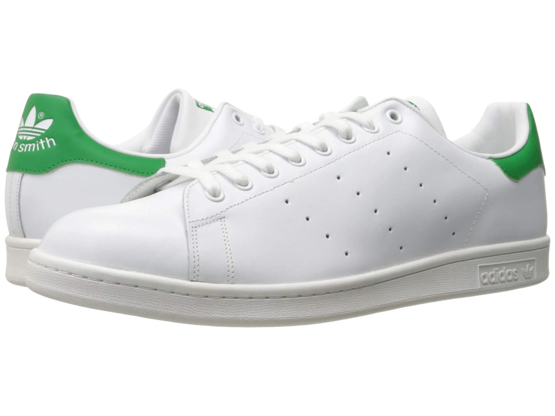 White and green sneakers on a white background.