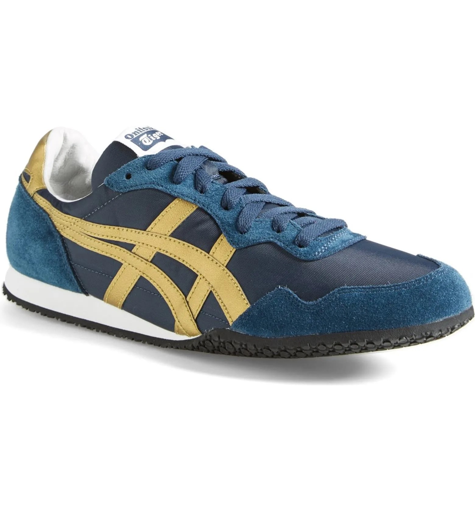 A blue and gold sneaker on a gray background.