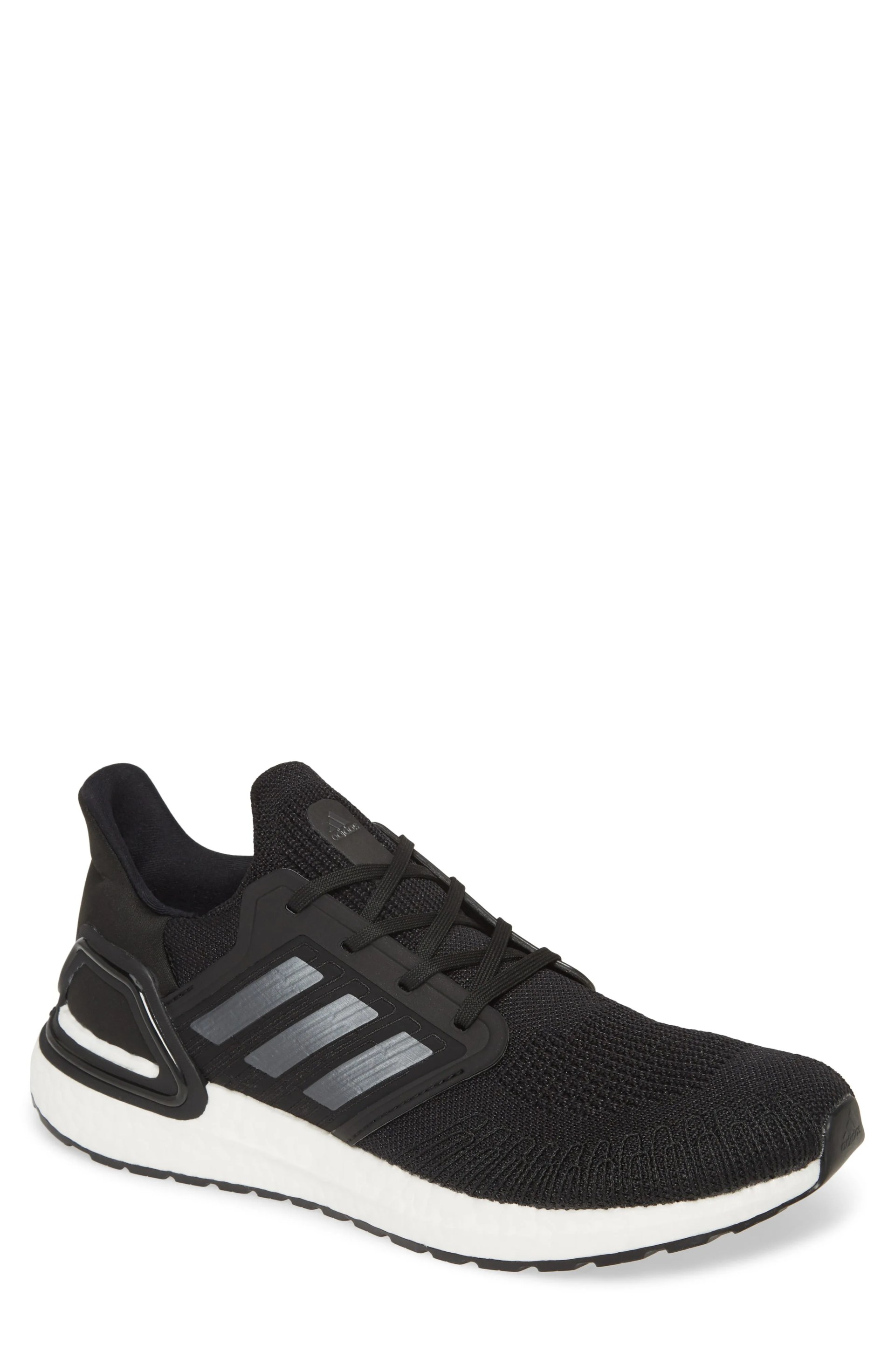 A black and white running shoe on a gray background.