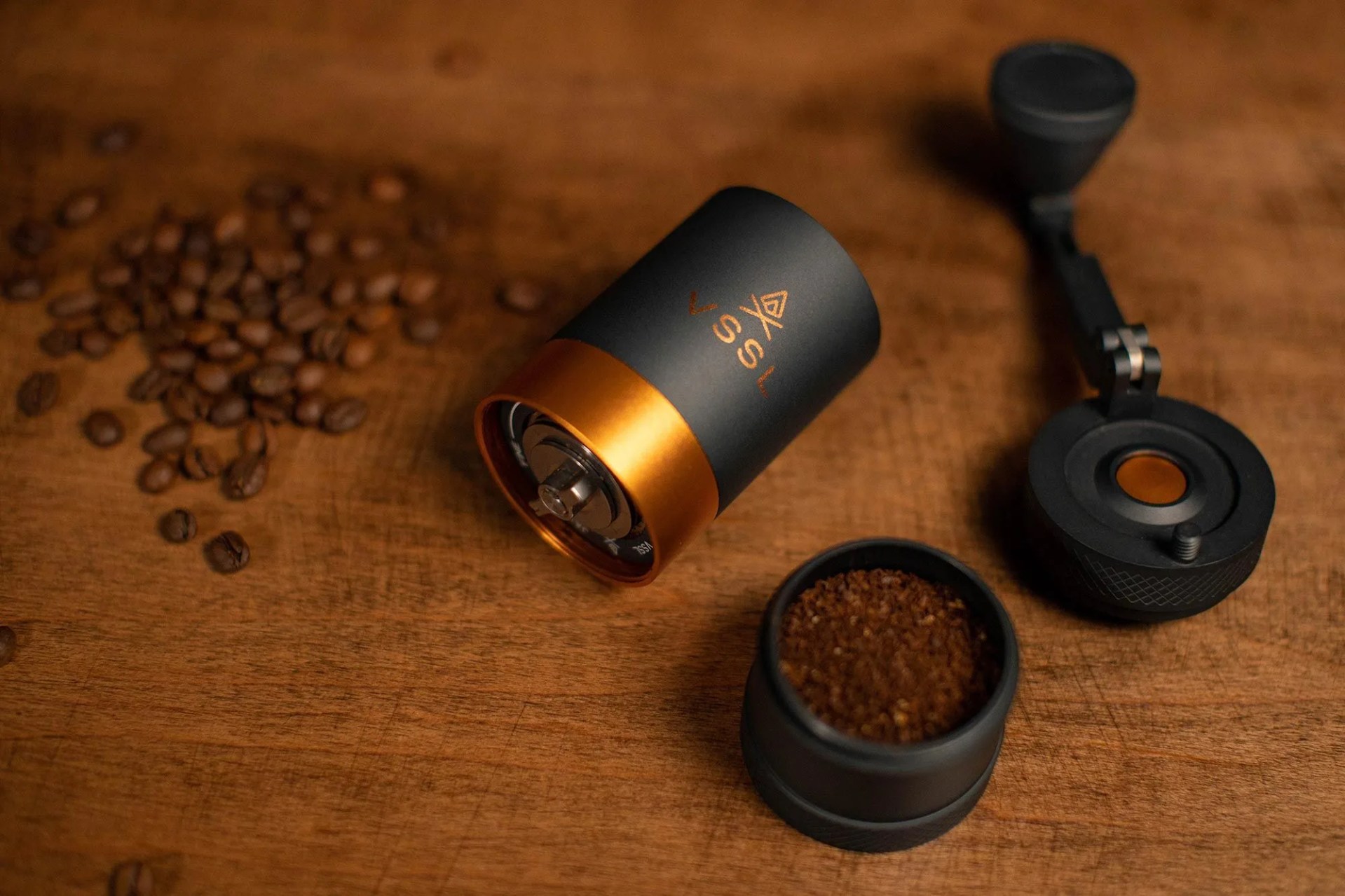 deconstructed hand coffee grinder on wood