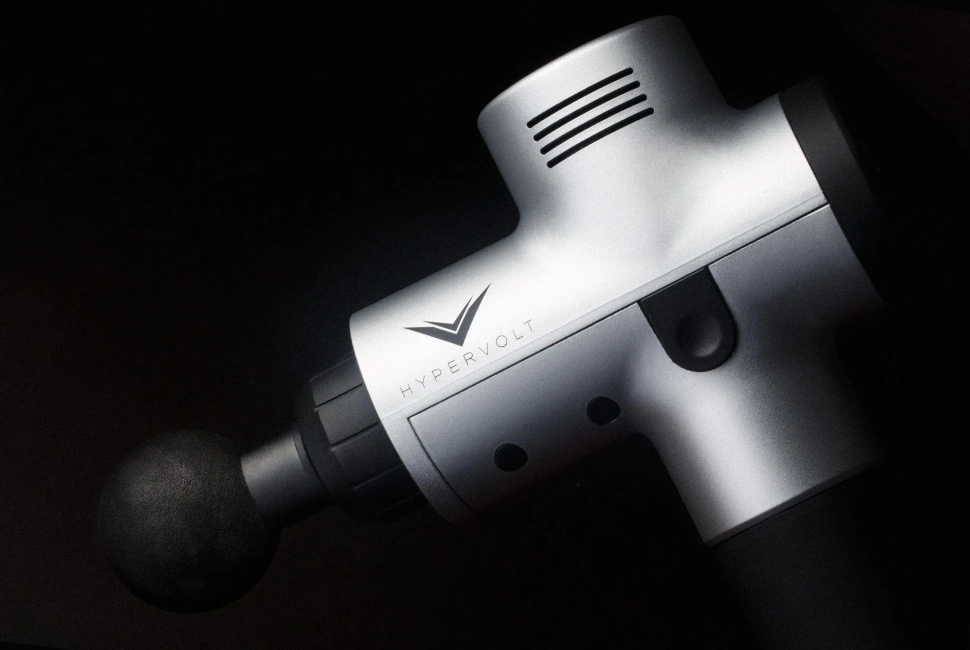 a close up of a percussion massage gun