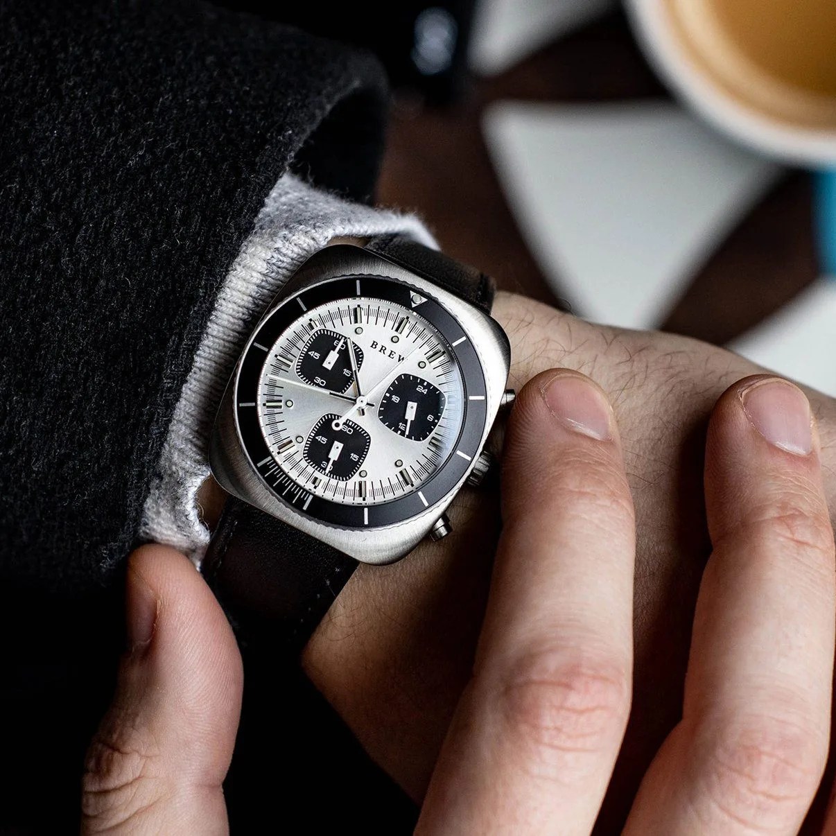 brew chronograph watch on wrist operating pusher