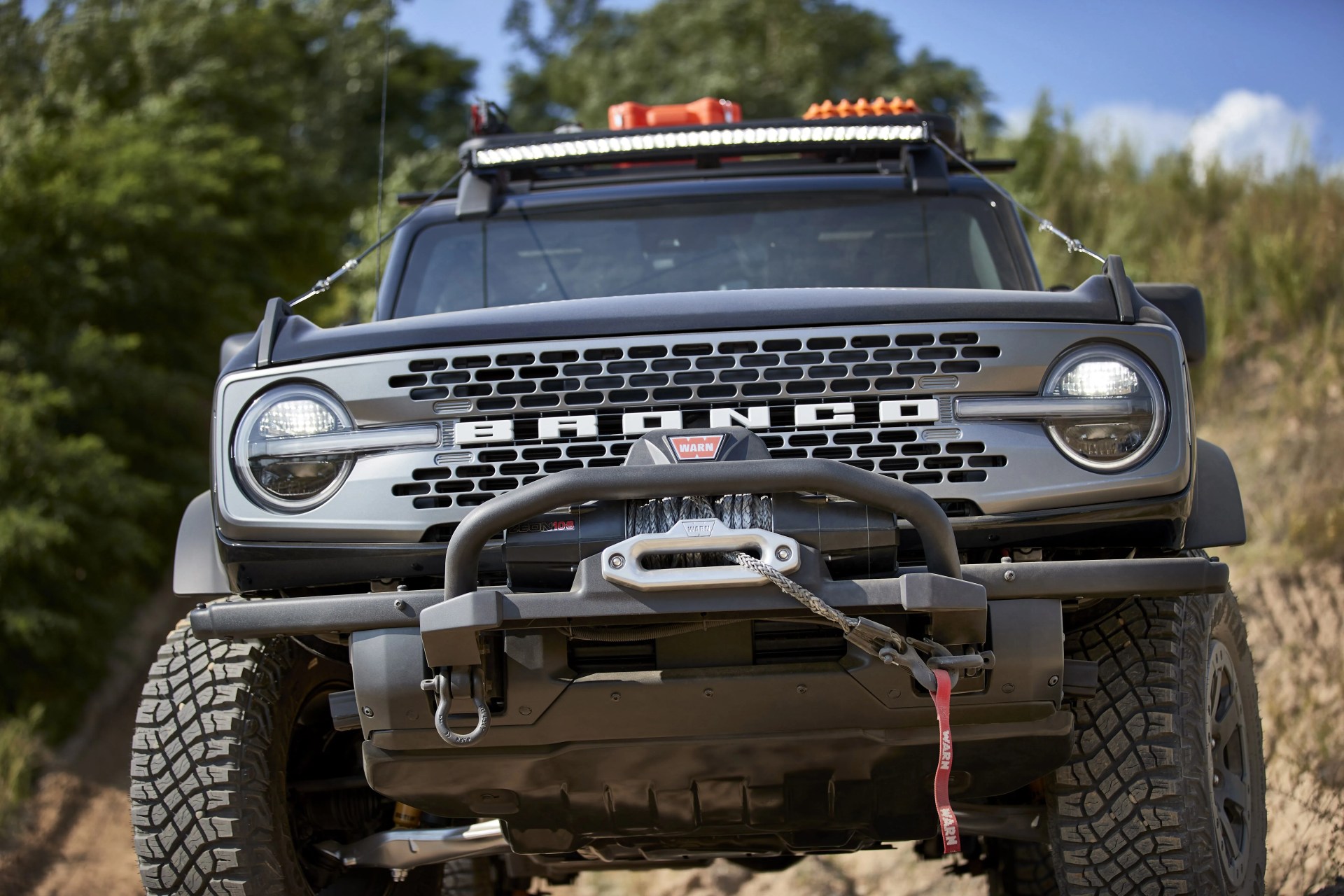 bronco two door trail rig designed to be the ultimate hardcore trail rider, this custom build is based on the two door badlands™ series it begins with a ford performance modular front bumper, tube doors, beadlock capable wheels and 40 inch rigid® led lightbar a ford performance by warn® winch helps rescue your lesser equipped 4x4 friends on top, factory roof rails are augmented with a yakima platform roof rack system with mounts for a shovel, and ford performance by warn recovery kit and recovery boards inside are rugged floor mats and a rear swing gate mounted table preproduction image with optional features shown available beginning spring 2021