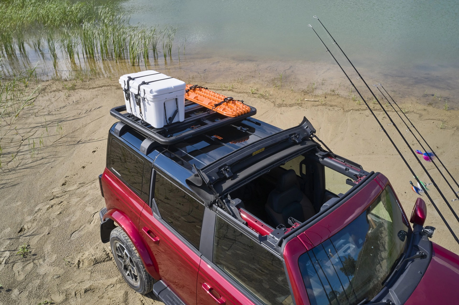 bronco four door outer banks fishing guide purpose built to support a professional fishing guide along cape hatteras national seashore, this lifestyle concept is based off the regionally inspired four door bronco outer banks™ series on top is a bestop® sunrider® first row soft top, factory style concept roof rails and crossbars, and a yakima® locknload™ platform roof rack the suv makes use of fender mounted trail sights to fit a custom made fishing pole and seat perch to wait for the perfect catch a ford performance modular front bumper and safari bar help push through rugged terrain, while a slide out tailgate provides a great work surface when repairing fishing rods or stringing up new lures all weather floor mats and splash guards round out the package preproduction image with optional features shown available beginning spring 2021 available late 2021