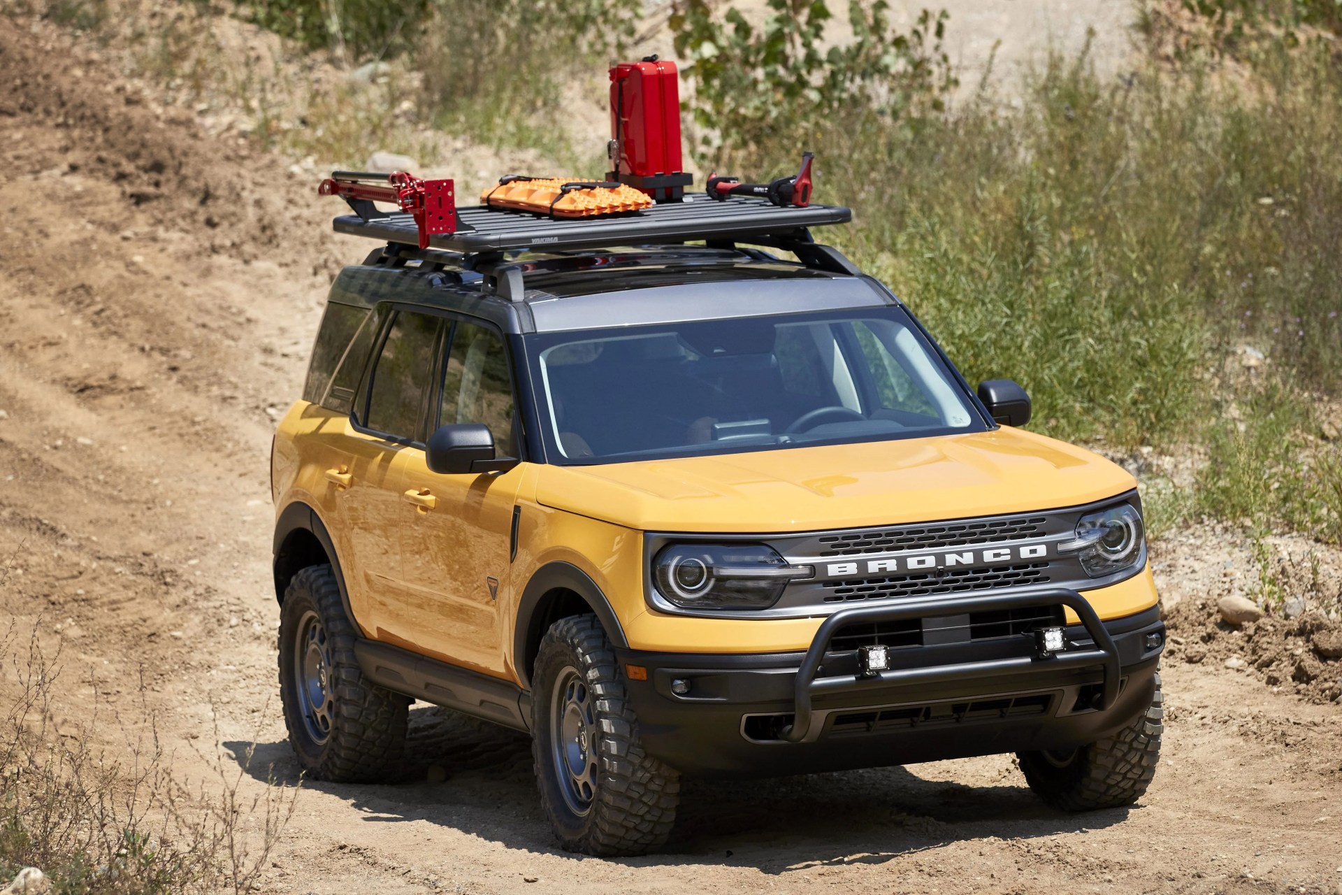 bronco sport trail rig for adventurers looking to elevate their off road trekking in a small, rugged 4x4, the bronco sport trail rig amps up the badlands series model by adding 31 inch bfgoodrich™ mud terrain ta® km3 tires, a one inch lift kit, plus ford performance by rigid led off road lights mounted to a front nudge bar on top, a yakima locknload platform roof rack and off road gear mounts are designed to carry gear like a high lift jack kit, ford performance recovery boards and jerry cans preproduction image with optional features shown available late 2020