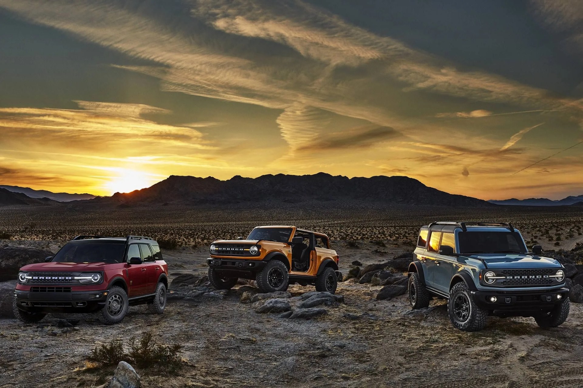 two and four door bronco and bronco sport posed on desert terrain