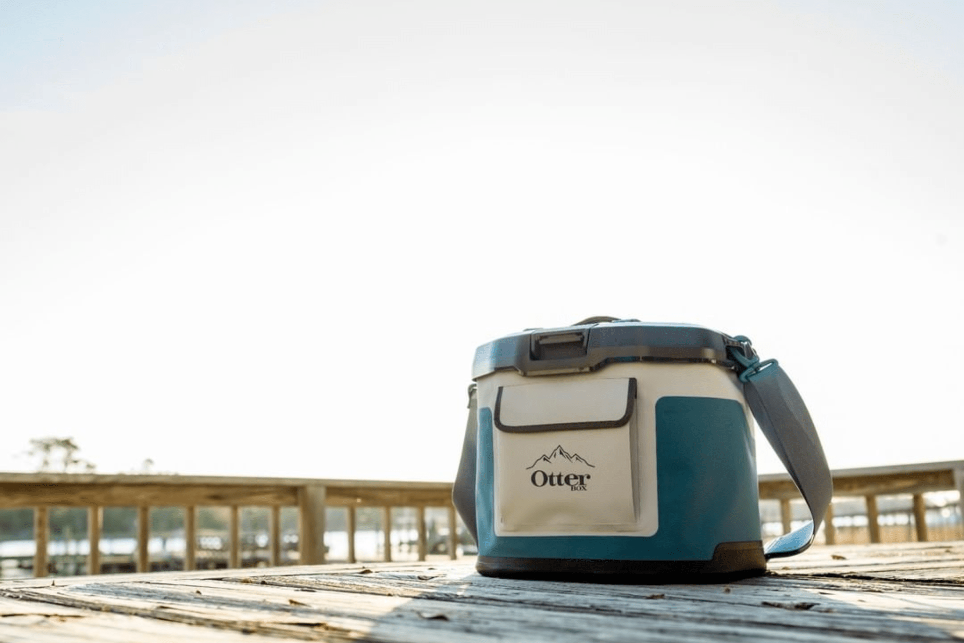 a soft cooler on a picnic table