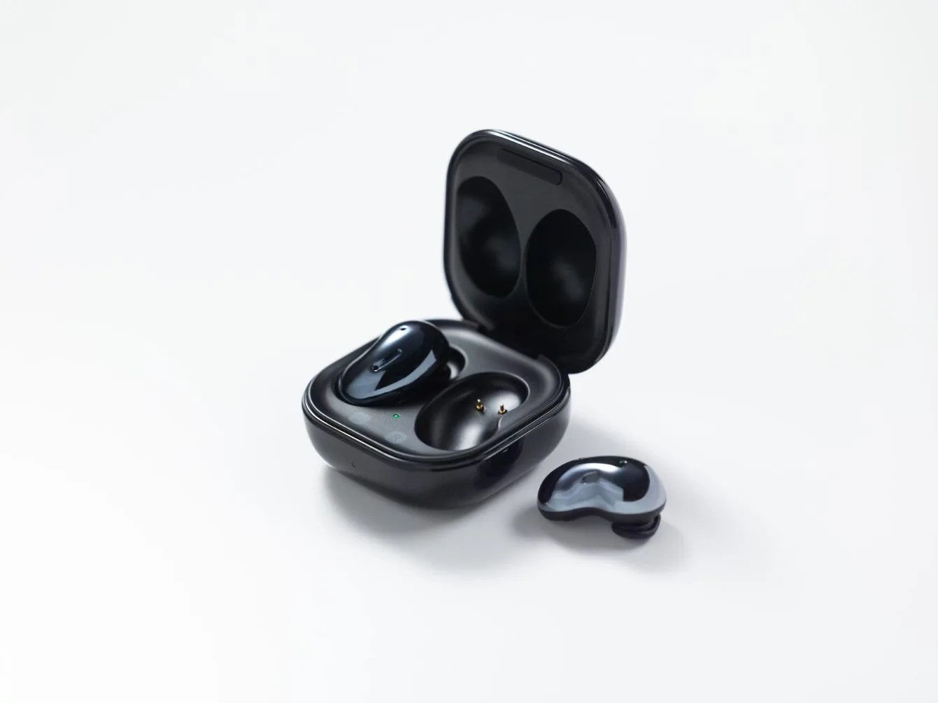 a pair of black samsung earbuds