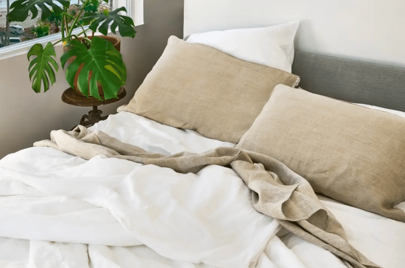 hemp bedding on a bed next to a plant
