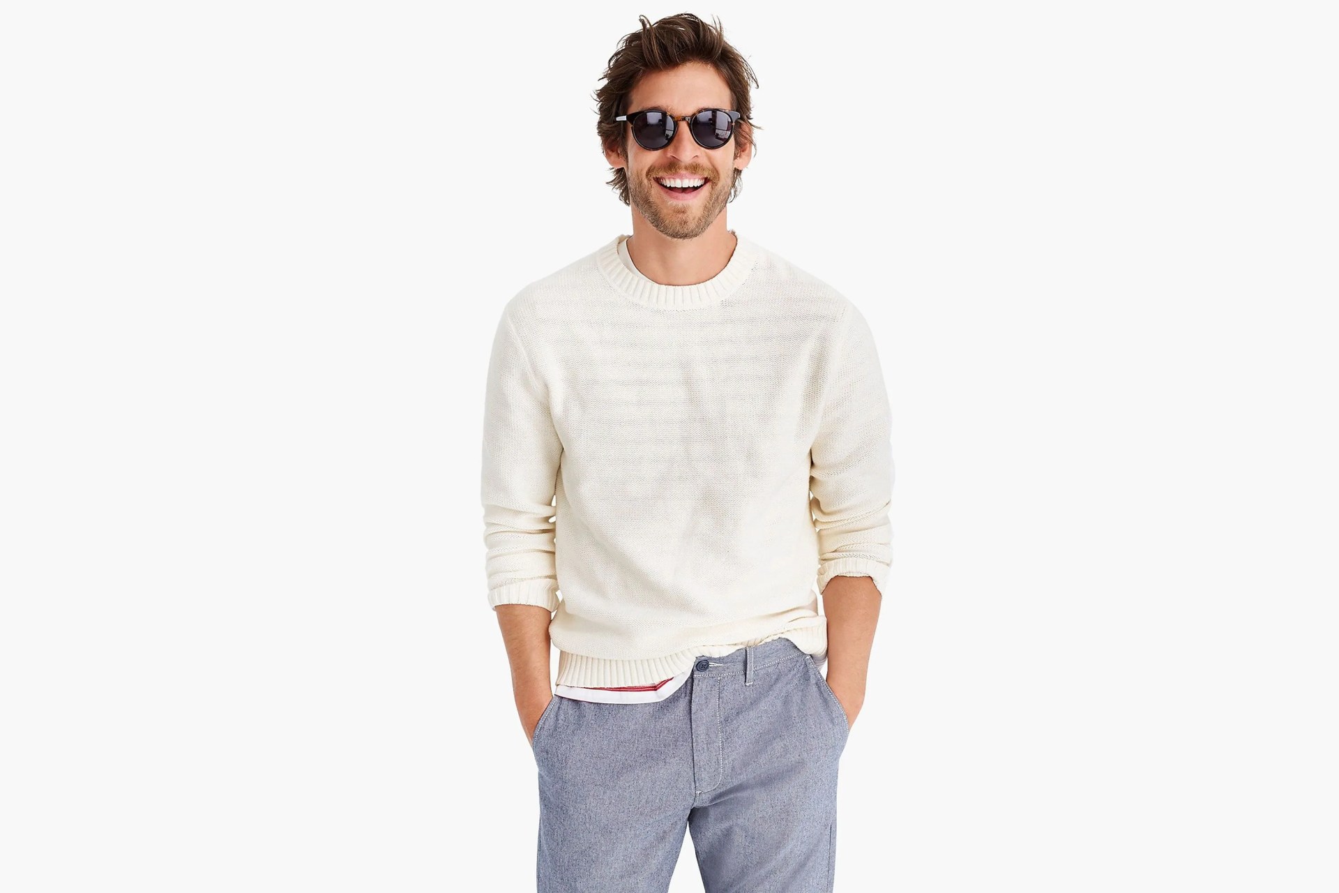 model wearing sunglasses and white sweater