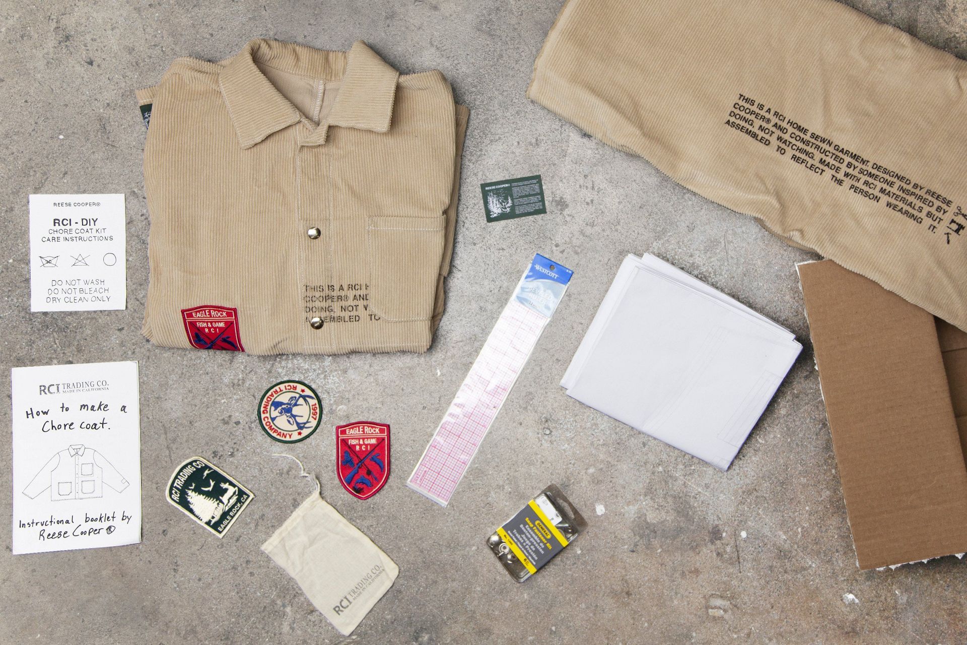 laydown of folded jacket with patches