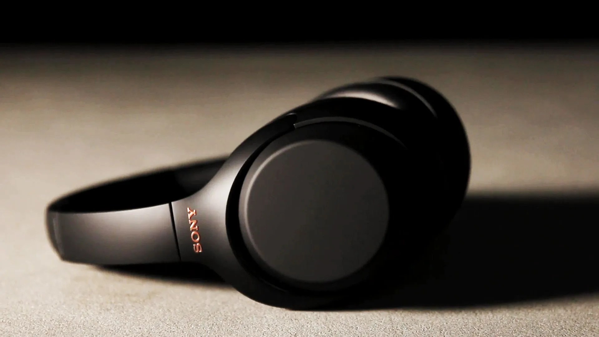 sony wh 1000xm3 noise cancelling headphones on a concrete table