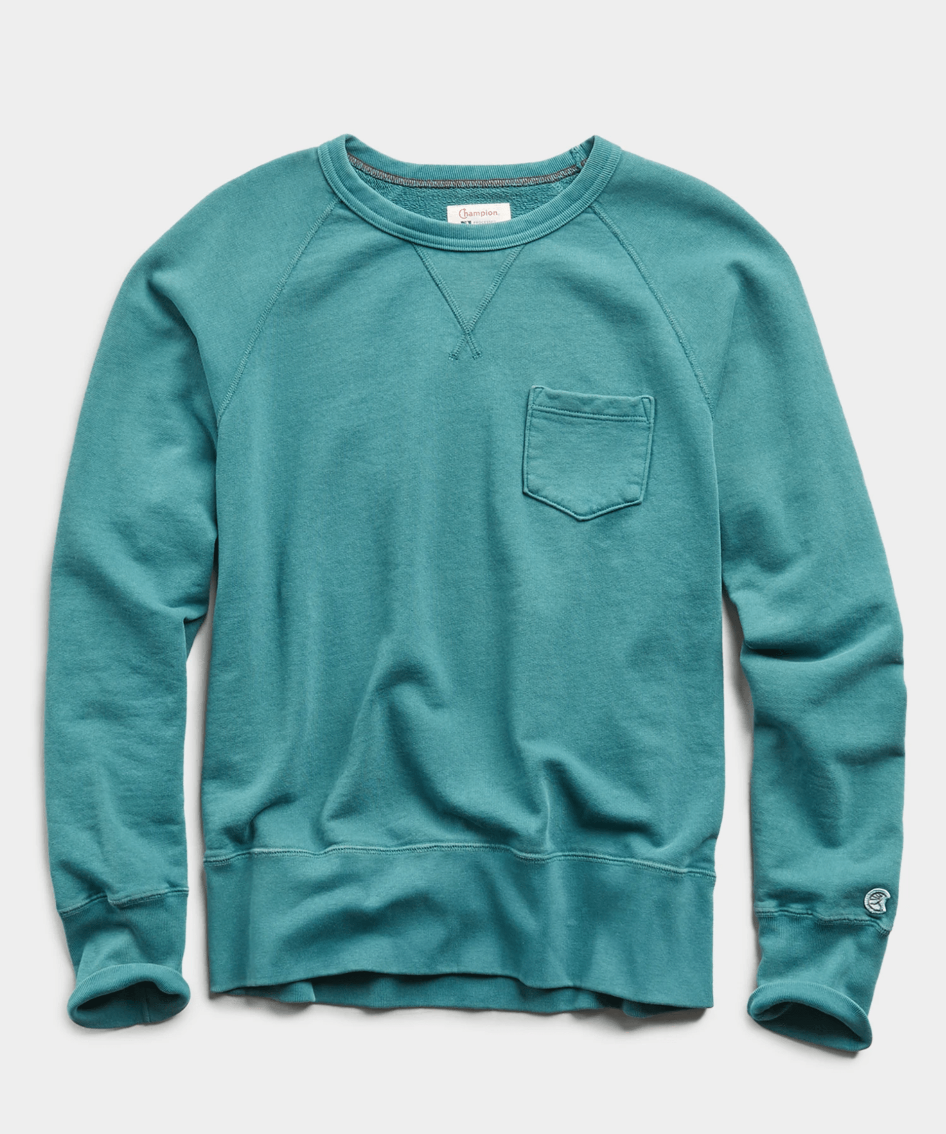 A teal crewneck sweatshirt on a gray background.