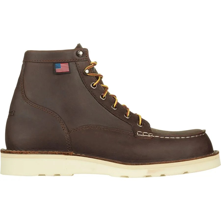 A brown leather boot on a gray background.