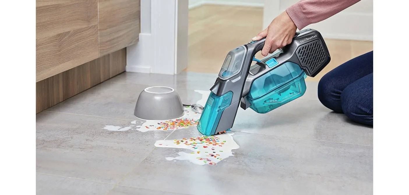 spillbuster sucking up cereal and milk off floor