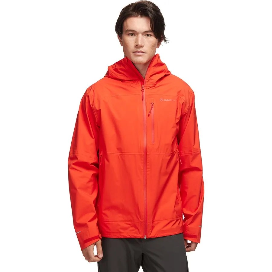 a man wearing a bright red rain jacket