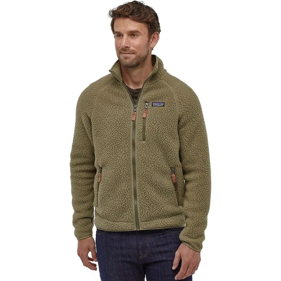 A model wearing a green fleece jacket and jeans