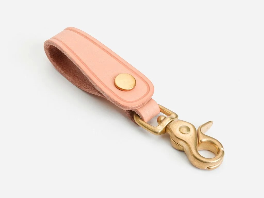 A leather and brass key chain