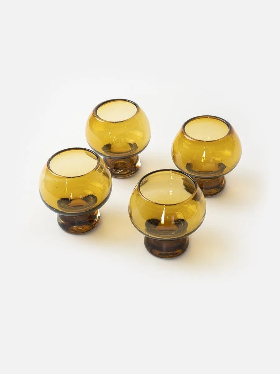 four mushroom-shaped glasses