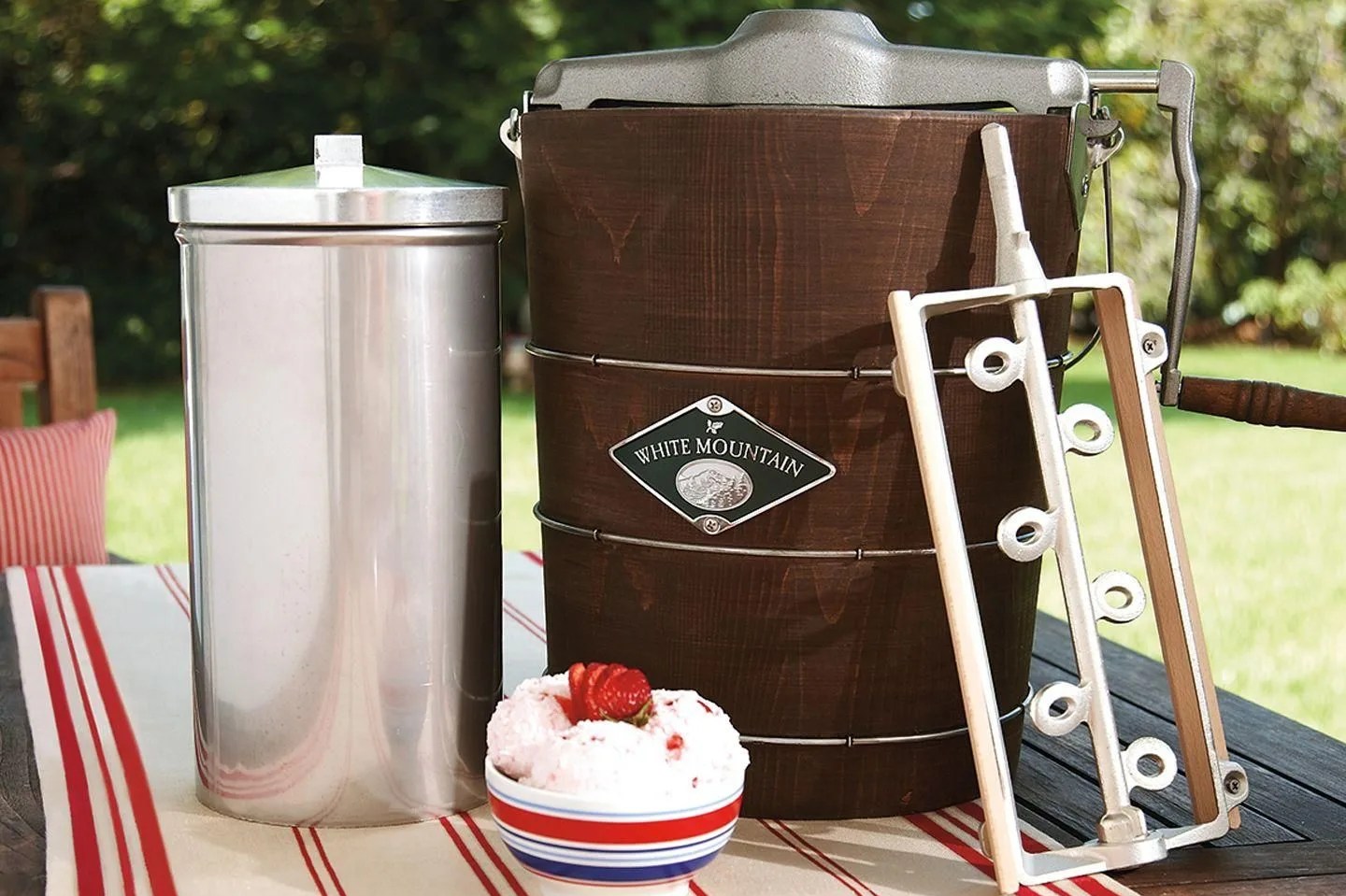 hand crank ice cream maker with bowl of ice cream