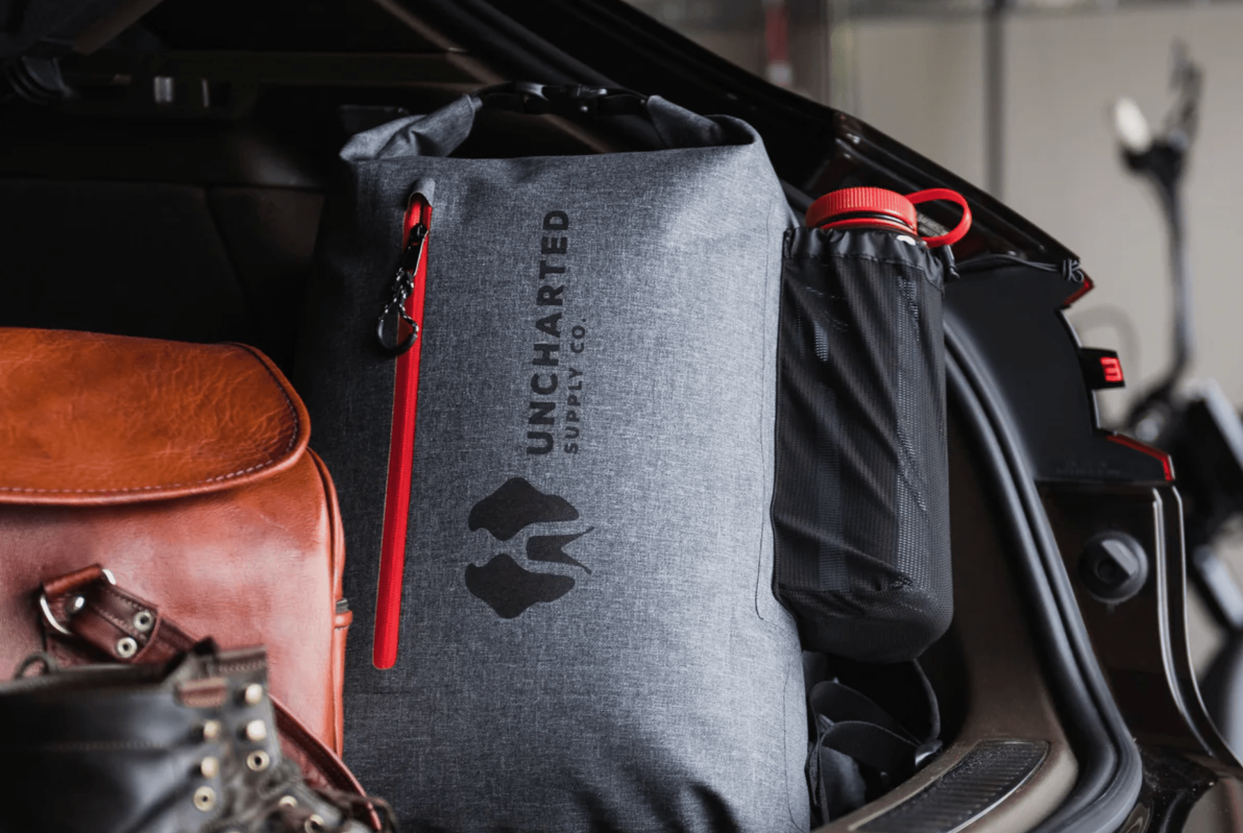 a survival bag in the back of a car