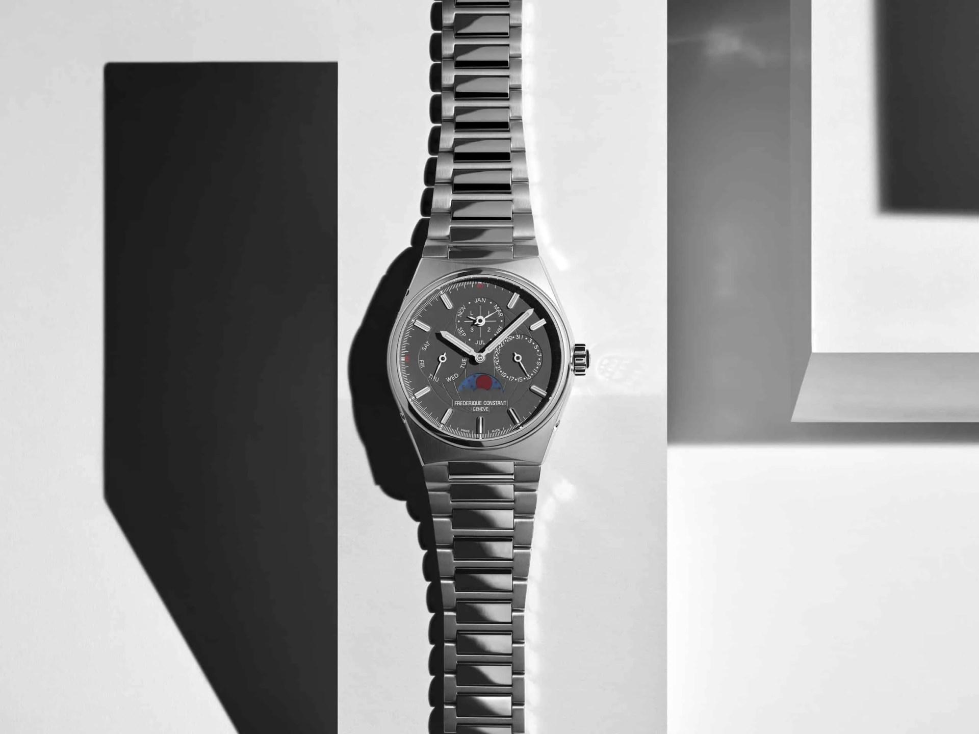 steel watch with geometric shapes