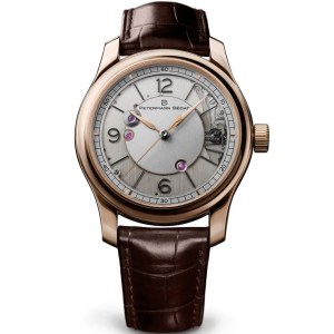 gold watch on brown strap
