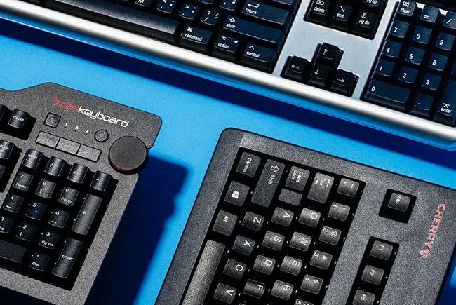 a picture of keyboards with a blue background