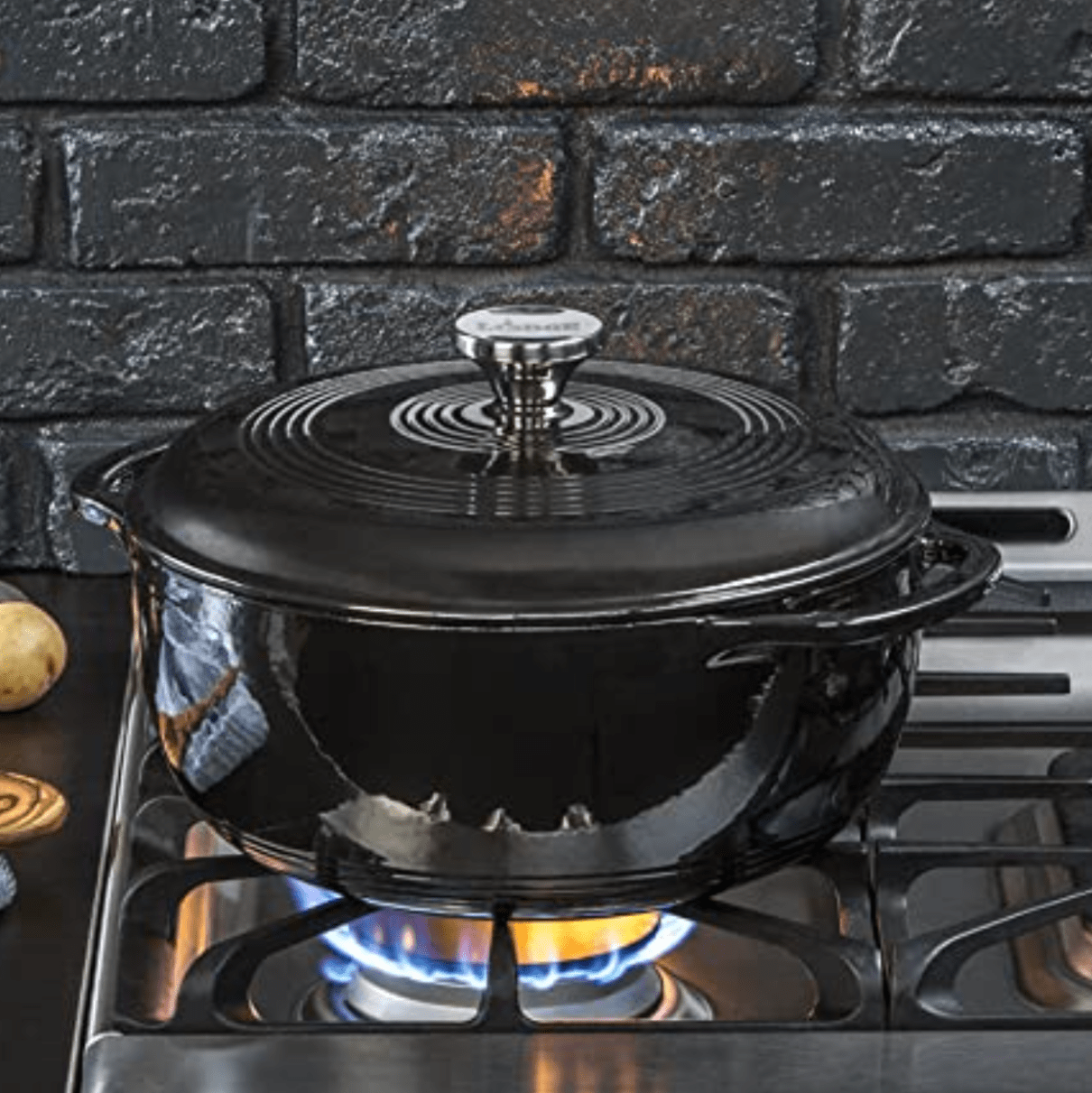 a black dutch oven on a stove top