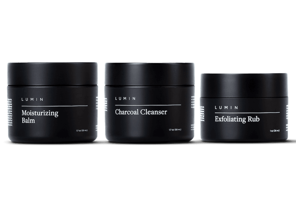 a three product skincare set on a gray background