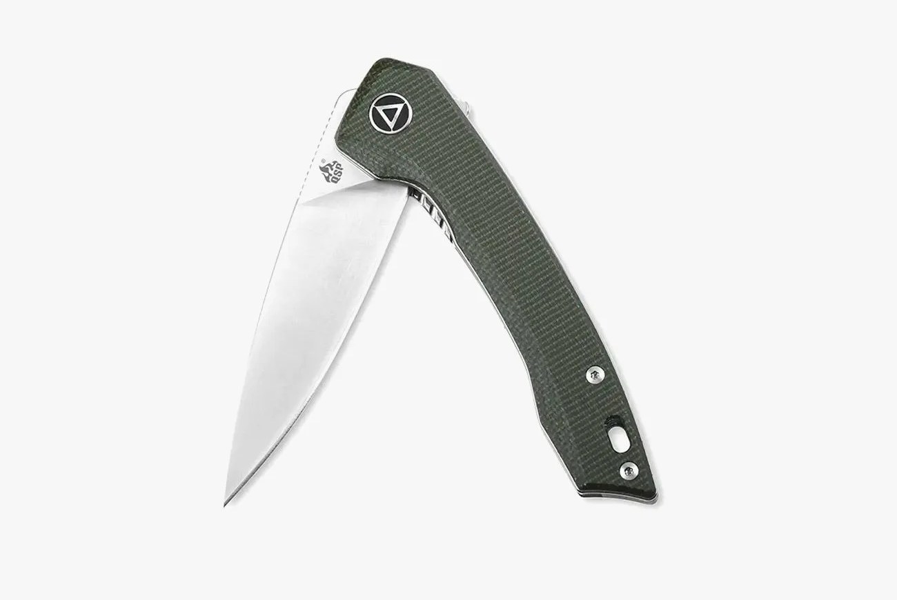 a folding knife with a green handle