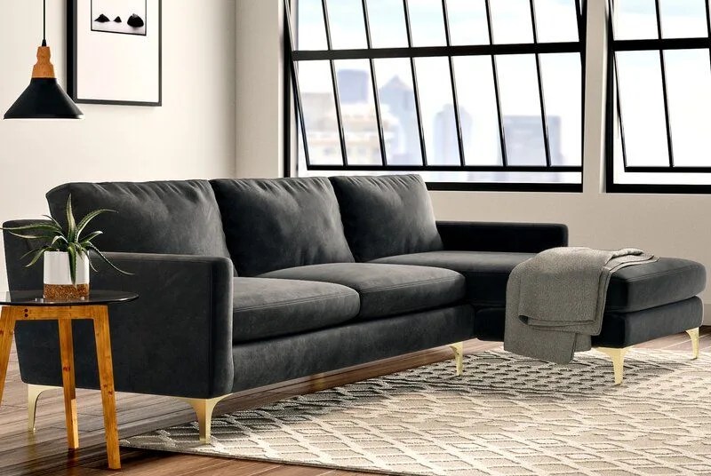 sofa, sidetable and ottoman in a room