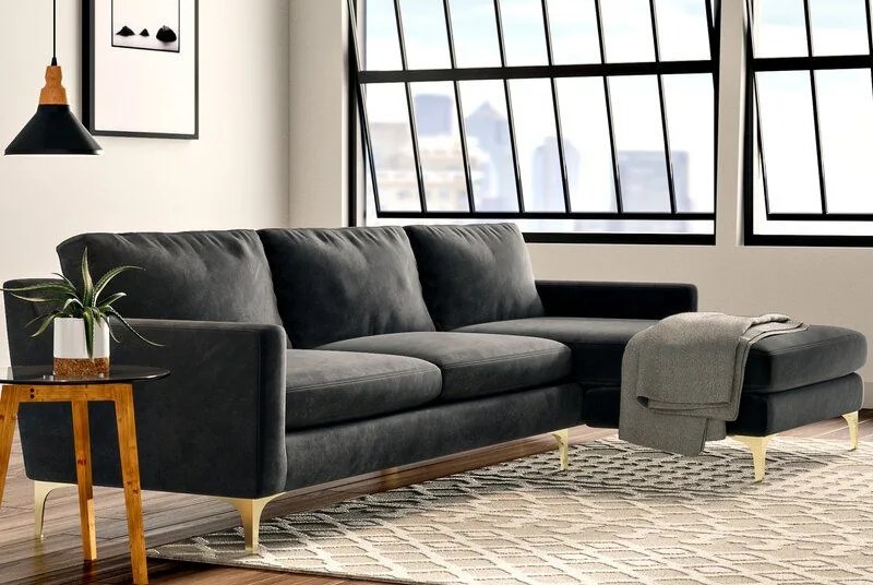 sofa, sidetable and ottoman in a room