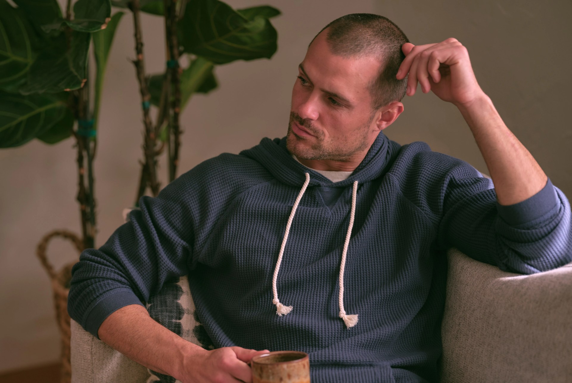 man sitting on couch