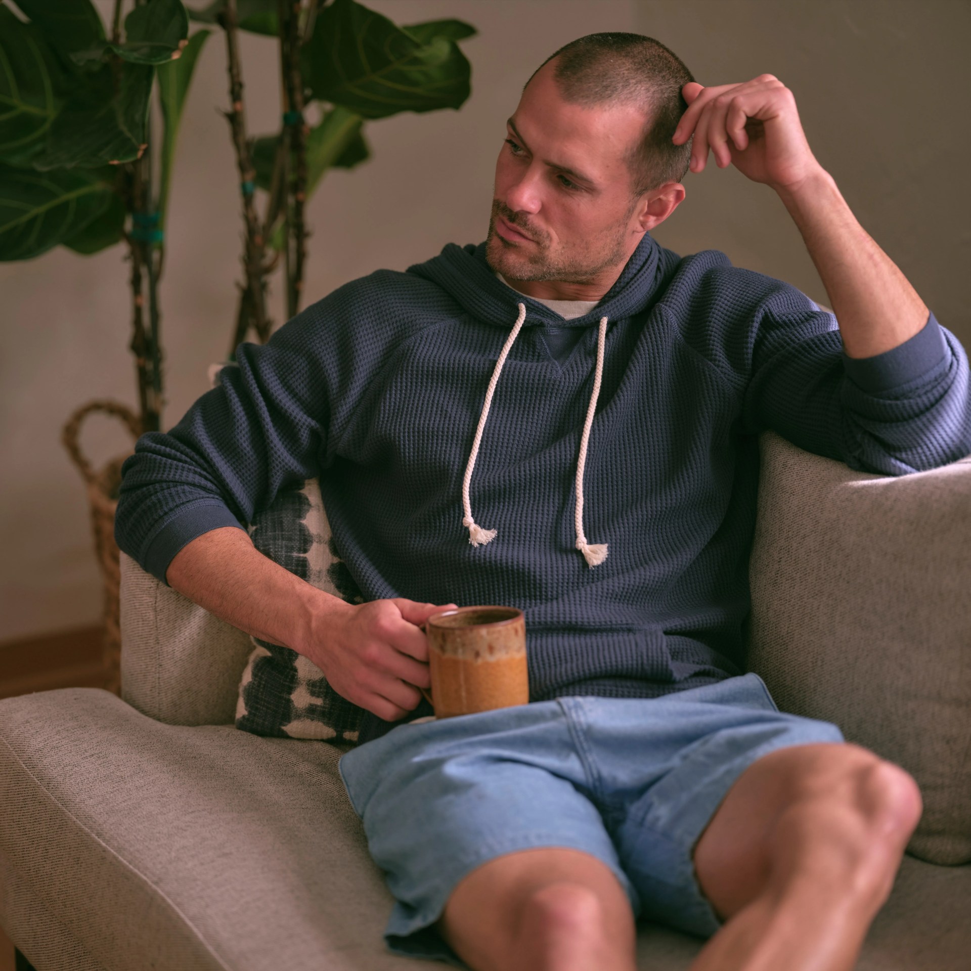 man sitting on couch