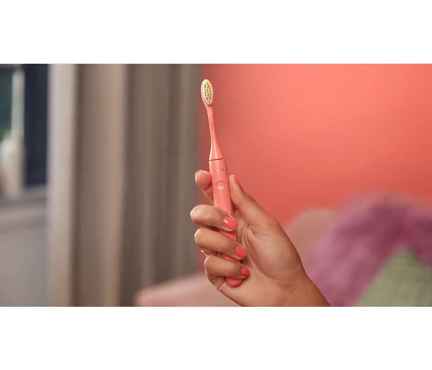 hand holding toothbrush
