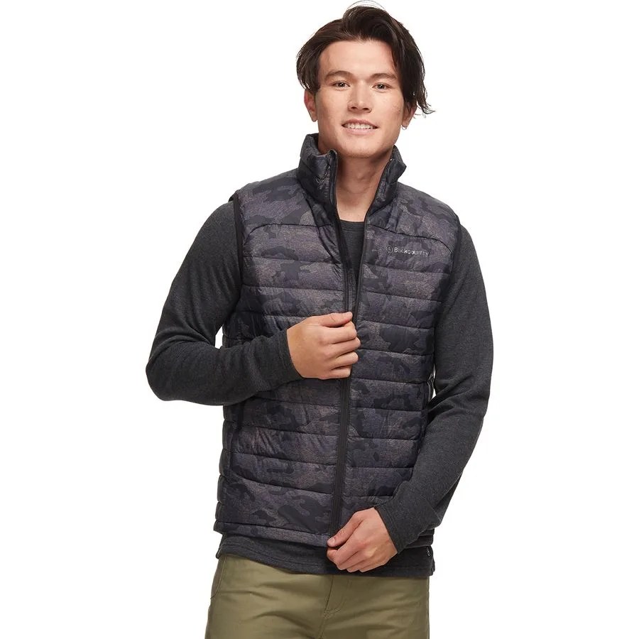 A model wearing a black camo puffer vest
