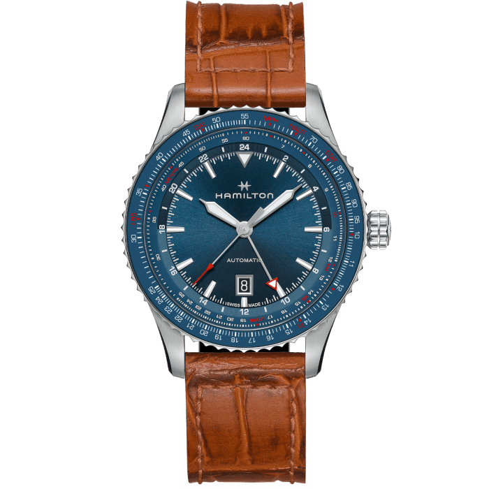 blue gmt watch on brown strap