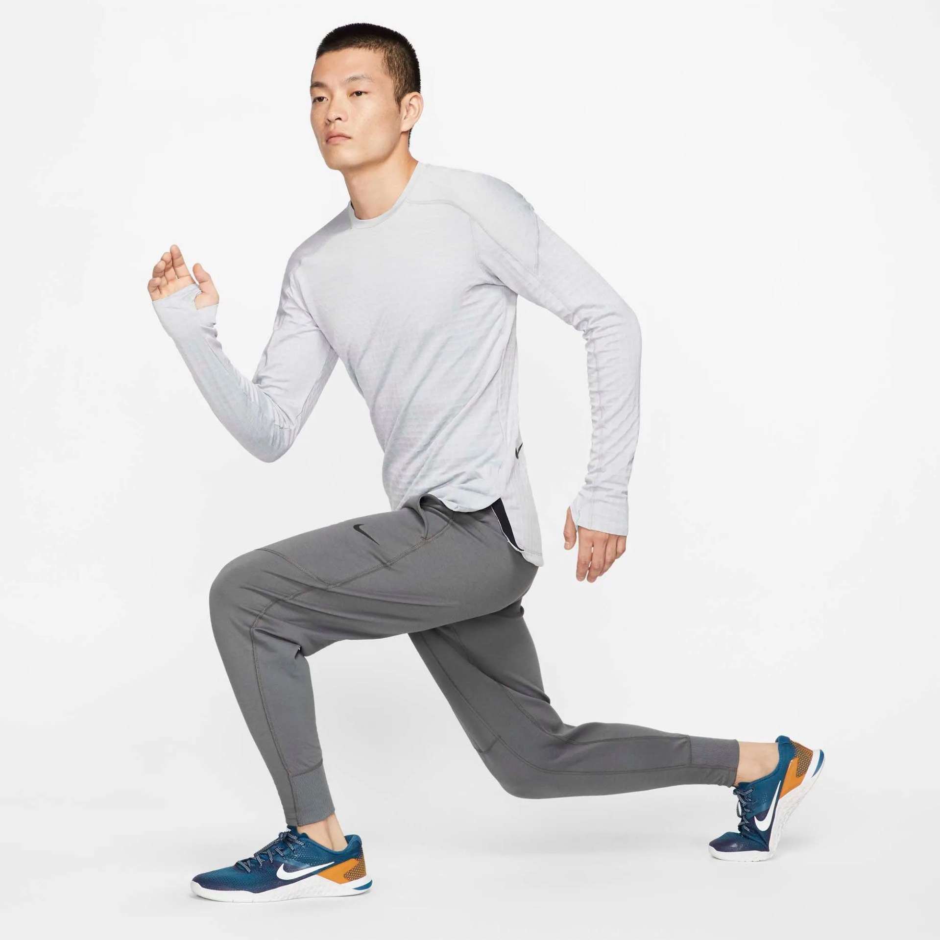 A model wearing gray sweatpants