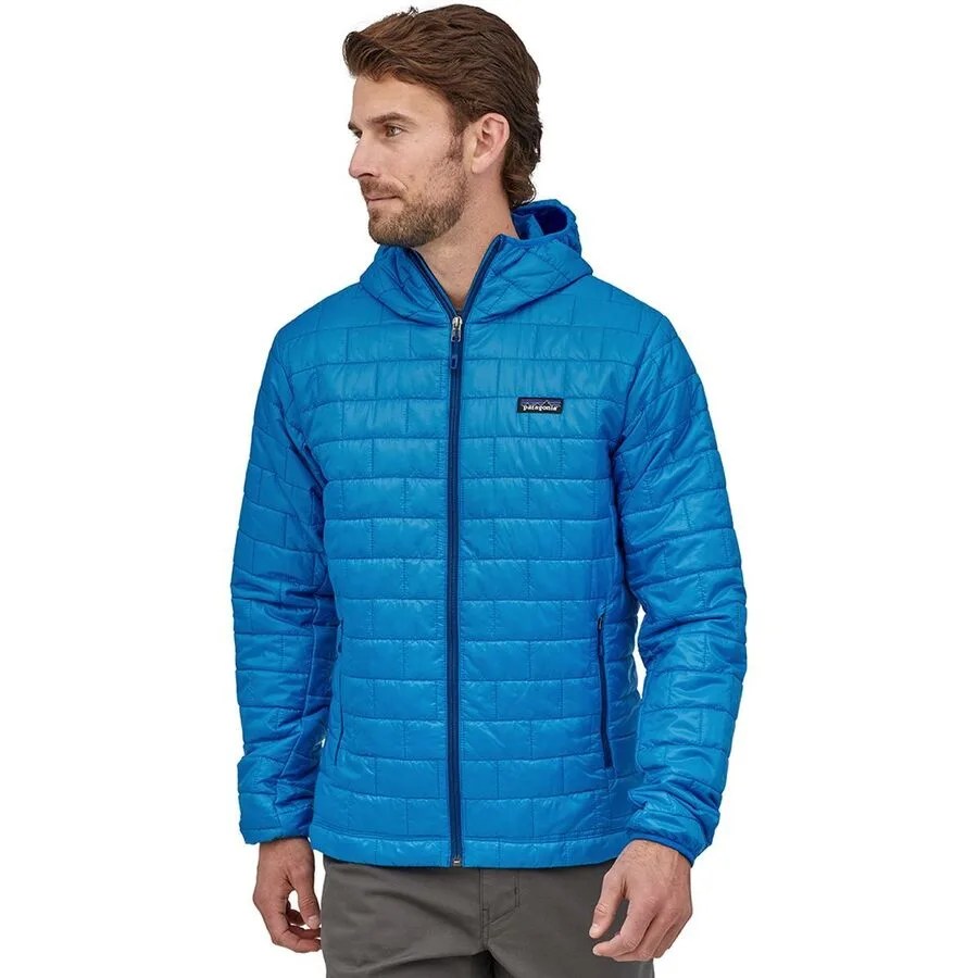 A model wearing a blue insulated jacket