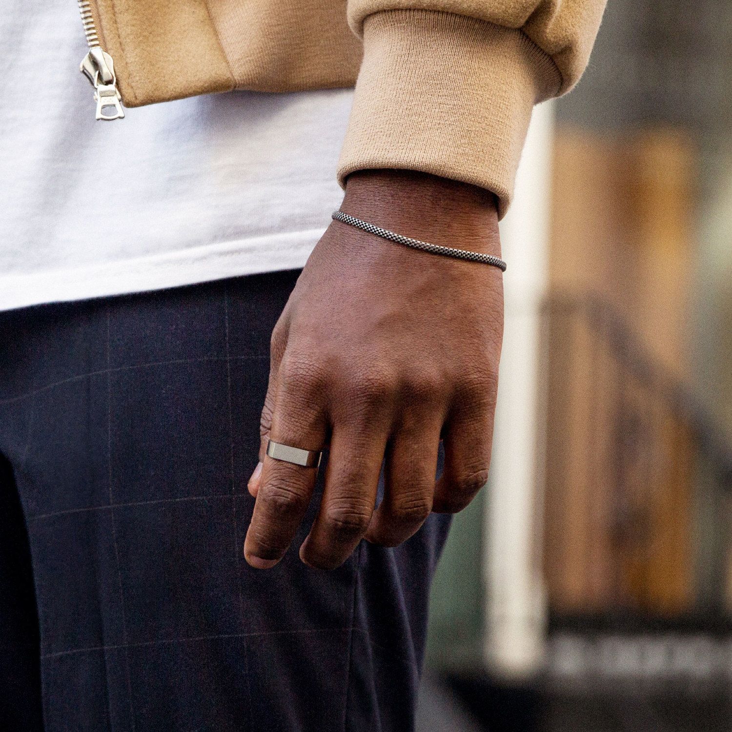 man wearing ring and bracelet