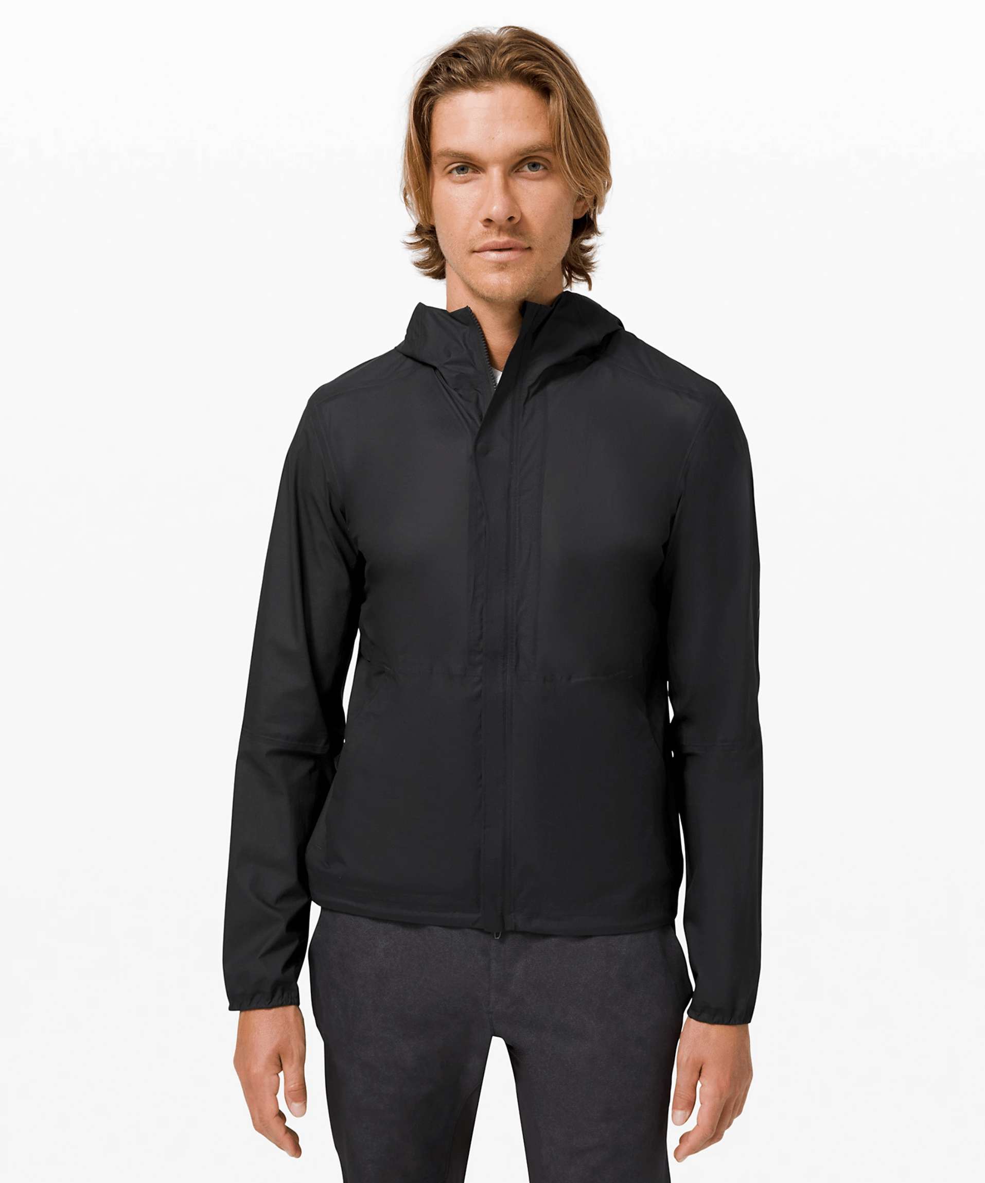 A model wearing a black windbreaker