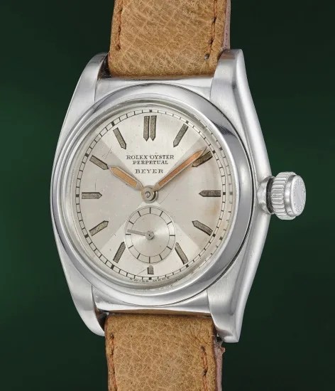 Ref. 1858 A highly rare and attractive stainless steel wristwatch with luminous "bow tie" dial and "bubble back" case, retailed by Beyer