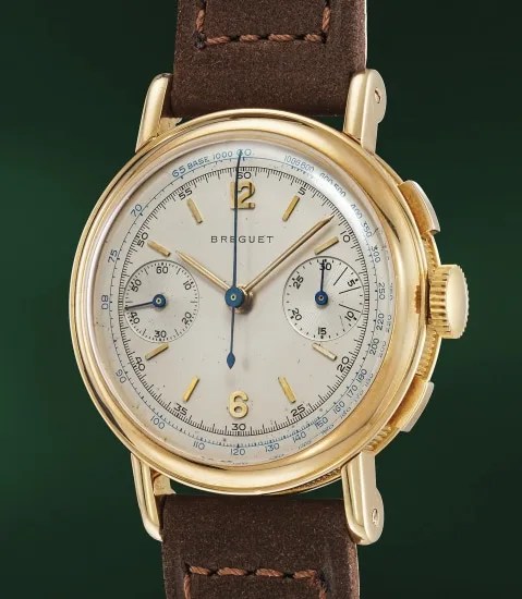 An incredibly well preserved and rare yellow gold chronograph with blue tachymeter scale
