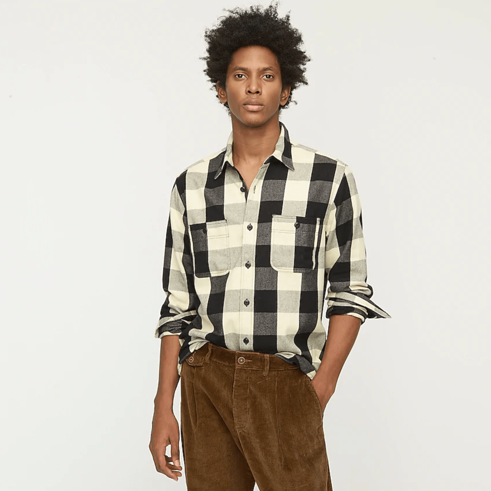 A model wearing a plaid flannel shirt