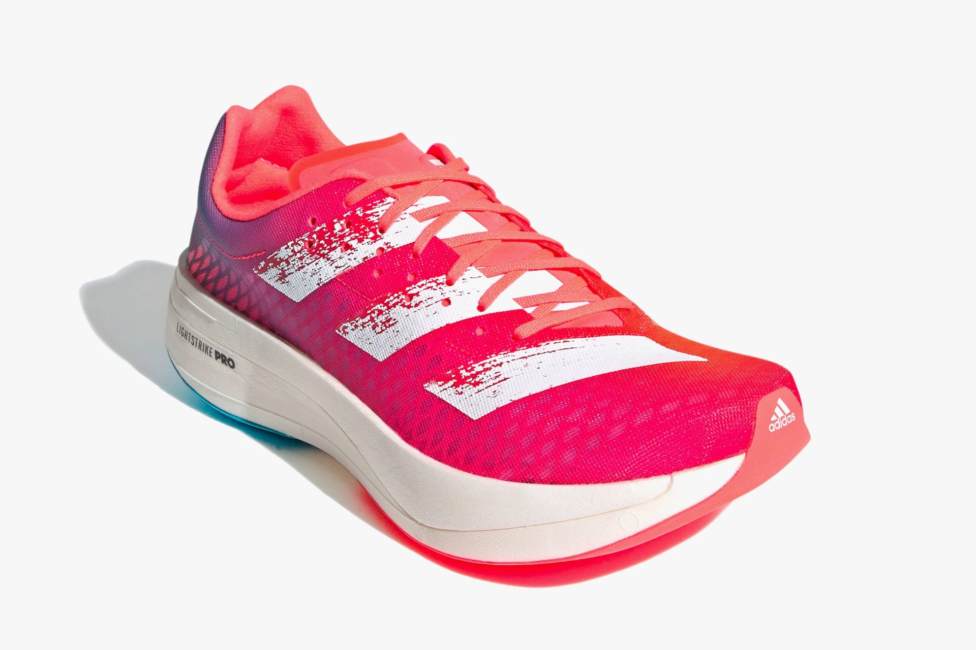 a pink running shoe with white accents